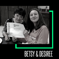 Image of Big Sister Betsy and Little Sister Desiree from Allegan County receiving an award from Big Brothers Big Sisters.