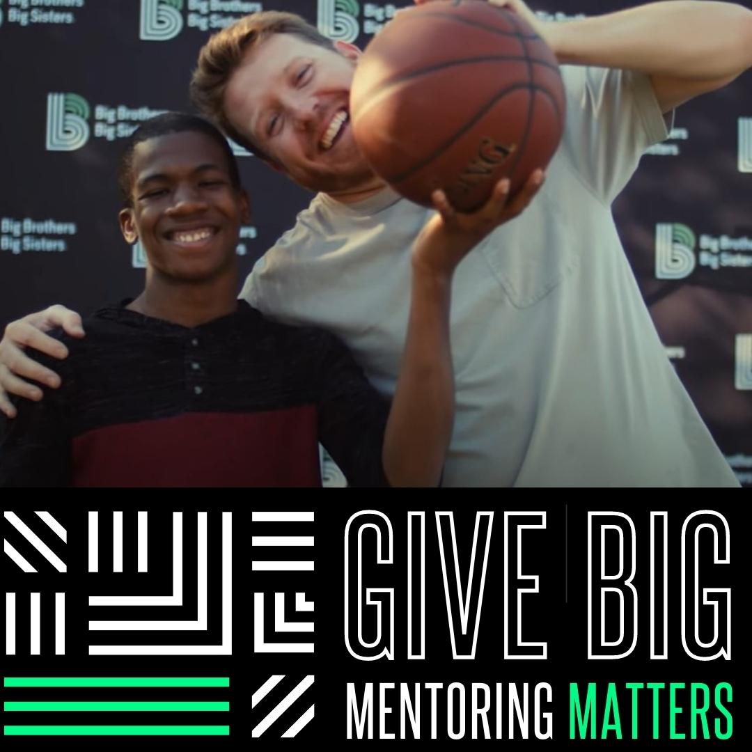 Kevin and Alex smiling at the camera, holding a basketball together. On the bottom it says, "Give Big. Mentoring Matters."
