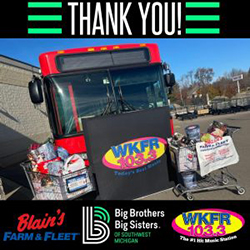 A city bus with carts of gifts surrounding it, and the 103.3 WKFR logo in front. On the bottom are the Blains Farm & Fleet logo, the BBBS logo, and the WKFR logo. Across the top it says Thank You!