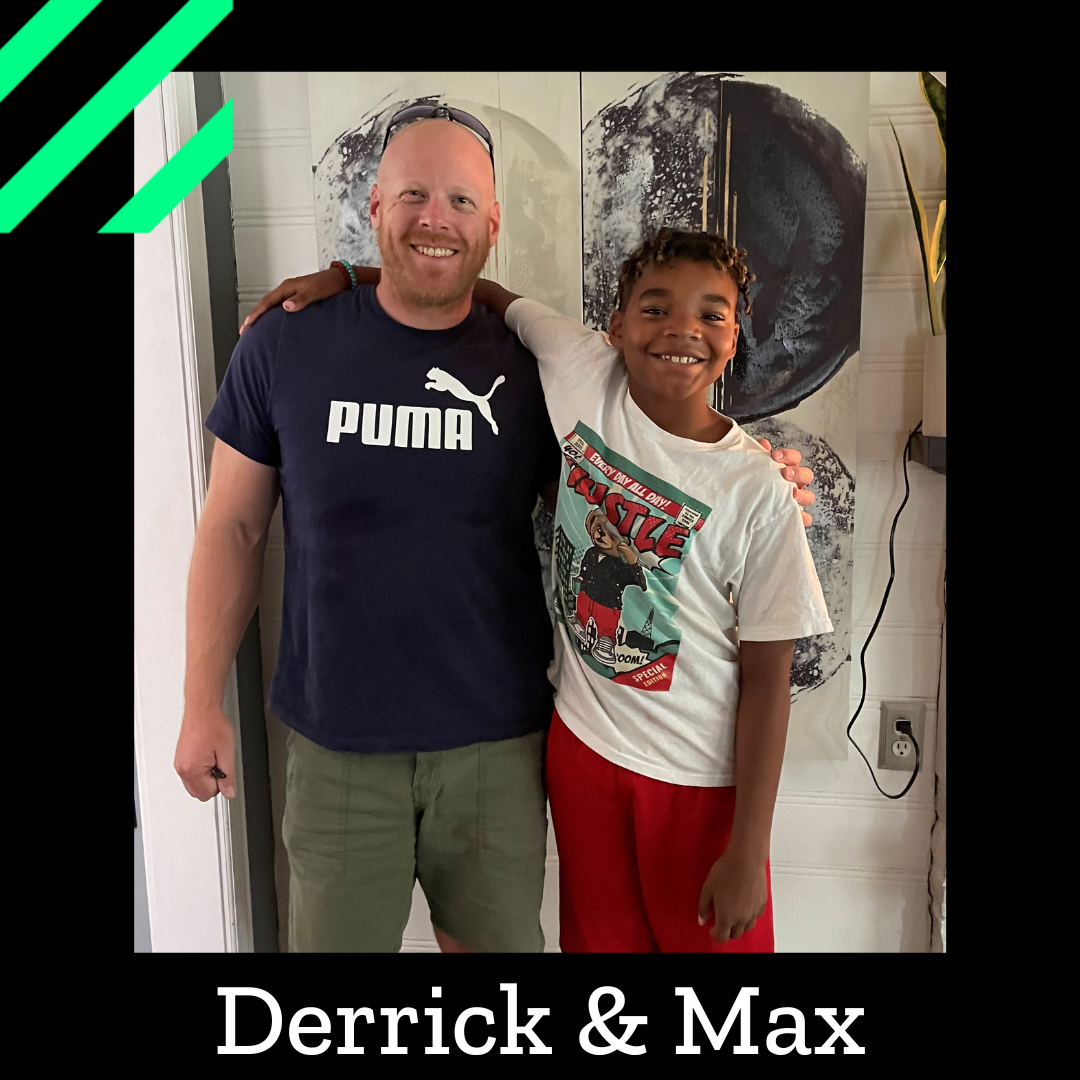 Derrick and Max stand, smiling at the camera with an arm around each other's shoulders.