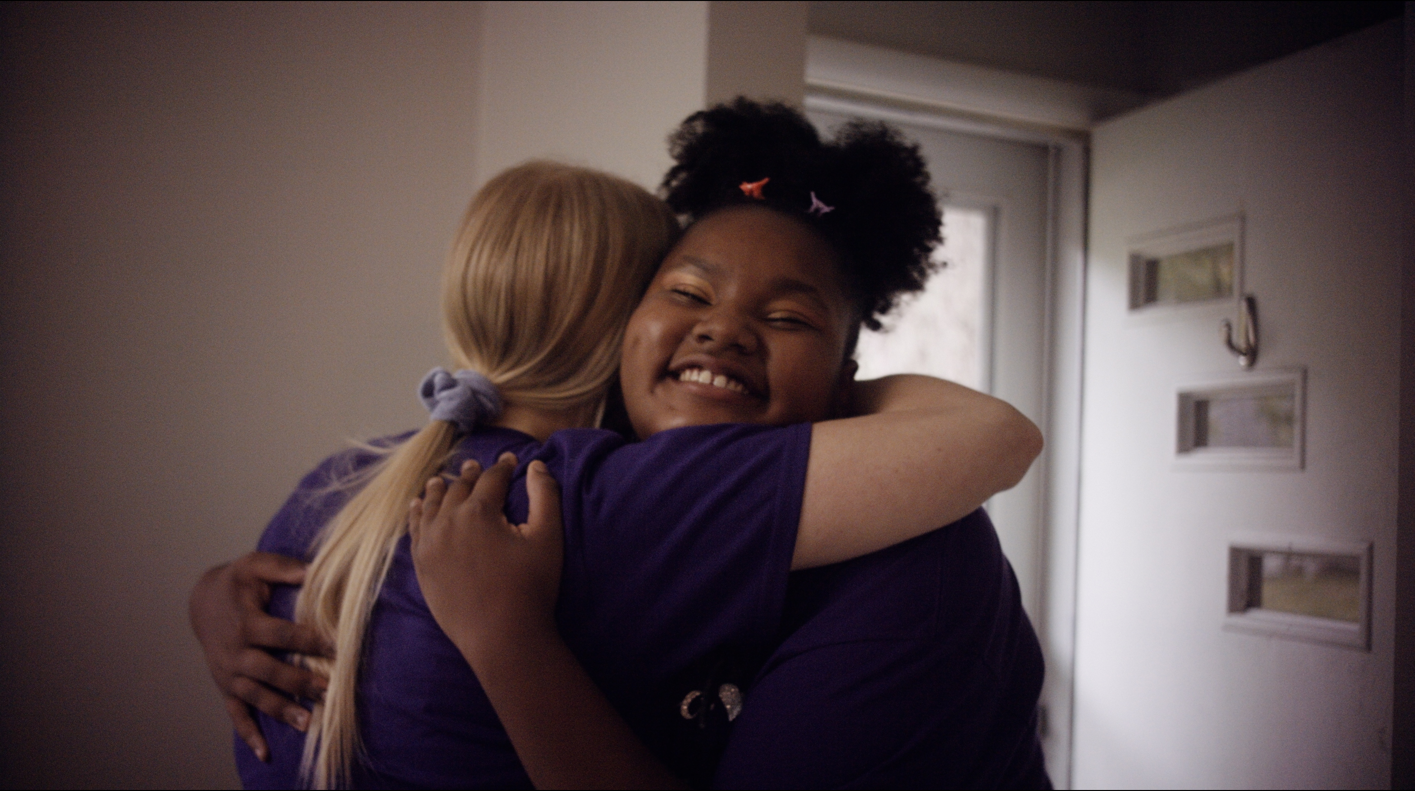 Clare and Jaliyah hugging.
