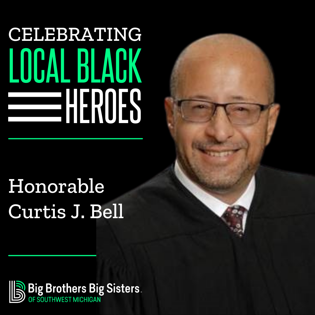 On the left: Celebrating Local Black Heroes, Honorable Curtis J. Bell, on top of the horizontal BBBSMI logo. On the right, a headshot of Curtis J. Bell smiling at the camera.