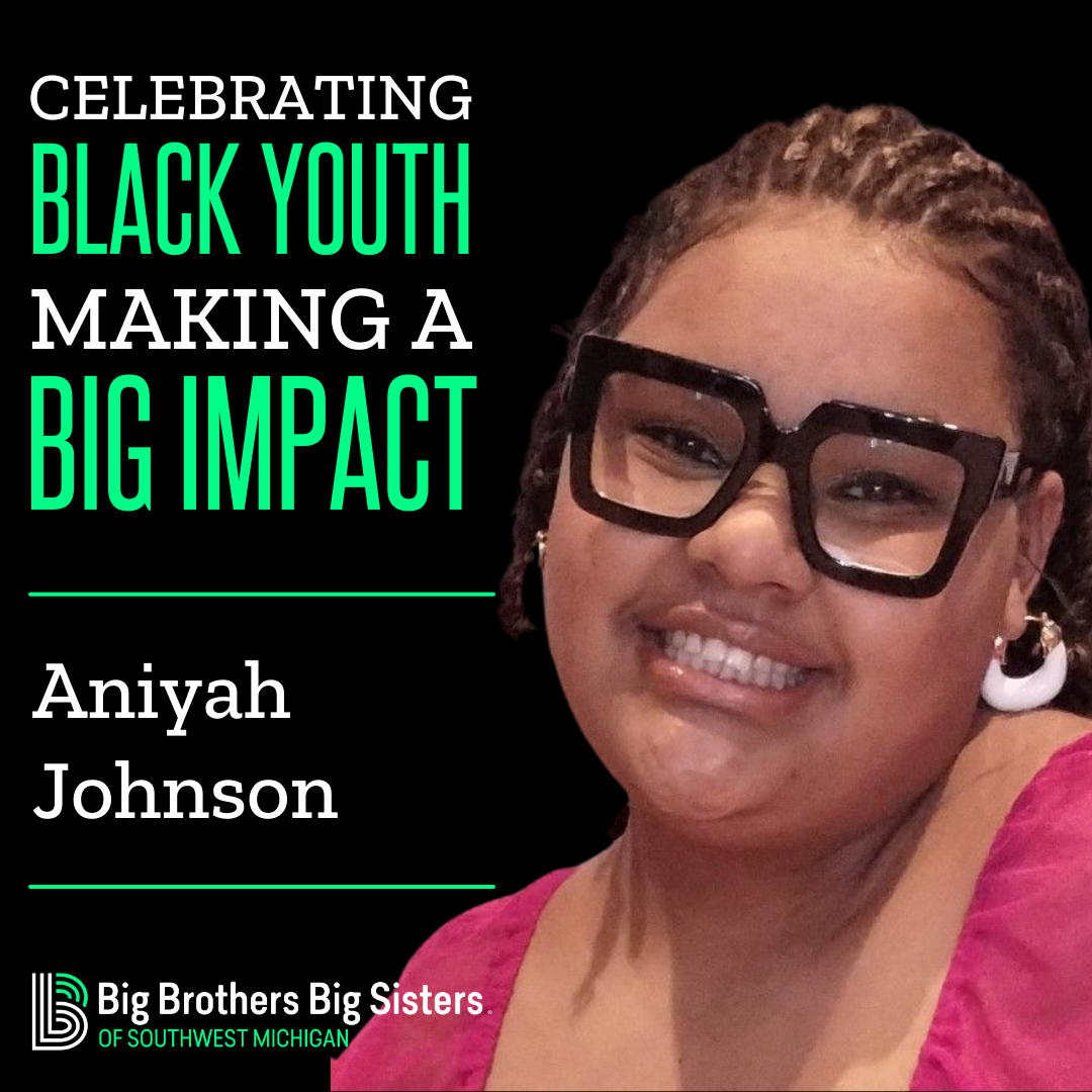 On the left: "Celebrating Black Youth Making a Big Impact" on top of the name "Aniyah Johnson" on top of the horizontal BBBSMI logo. To the right is Aniyah, wearing black glasses and a pink top, smiling at the camera.