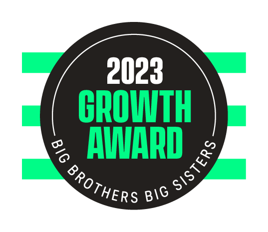 In a black circle are the words "2023 Growth Award; Big Brothers Big Sisters"